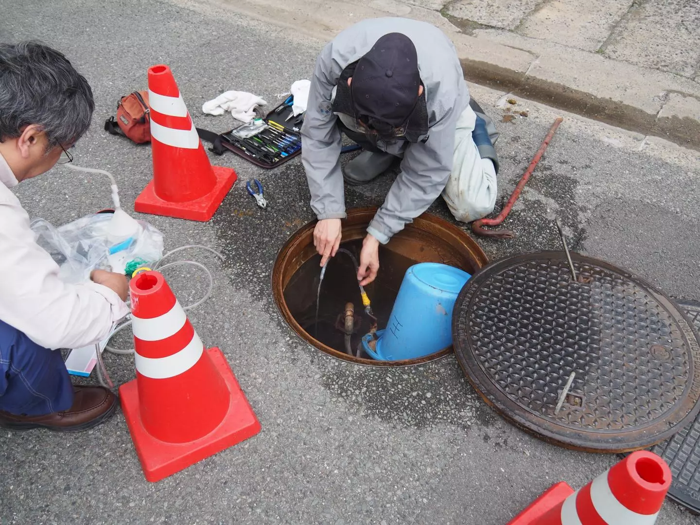 Scientist collect groundwater from a well near the site of this year's Kumamoto earthquake