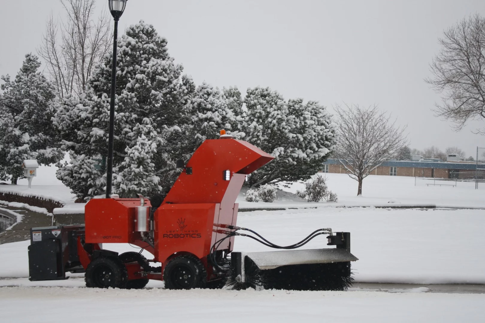 The SnowBot Pro is powered by a gas engine, and automatically avoids obstacles