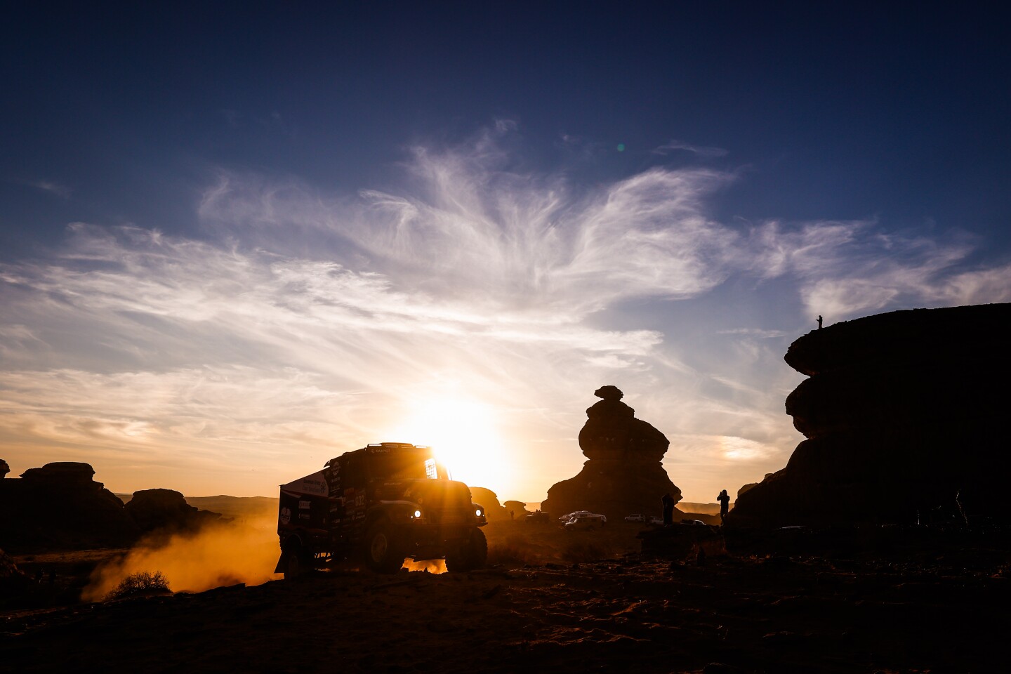The Dutch trio of Mitchel van den Brink (#602), Jarno Van De Pol, and Moises Torrallardona coming out of a sunset in a photo by Frédéric Le Floc'h that's worthy of a romance novel cover. Driving an Iveco for EUROL Rallysport in the Trucks category. They finished second overall in the Trucks category, which is known as the "angels of the desert" for always helping all competitors along the way