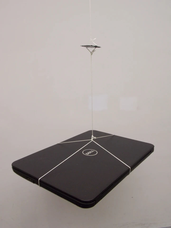 The engineers suspended a heavy laptop from the supercapacitor to demonstrate its strength (Photo: Vanderbilt Nanomaterials and Energy Devices Laboratory)