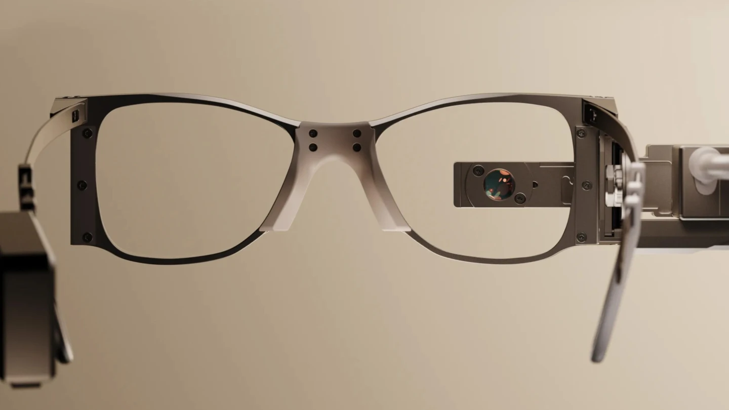 The PRIMA system also features specialized glasses that record the scene in front of the wearer, and uses an eye-facing projector to send the processed images to the chip