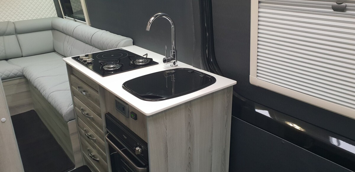 Small but well-equipped, the main kitchen block includes a hybrid induction/gas stove and an oven/grill