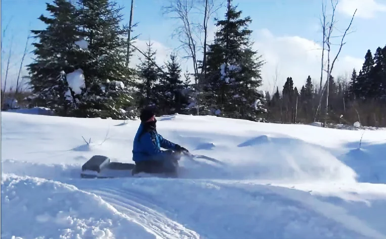 MTT-136's ground hugging, open-faced design, means riders will need to adjust to snow and mud in their face and seating area pretty much all the time