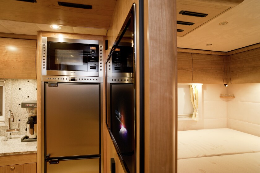 Inside, the mostrous mobile-home is designed to mirror a high-end apartment