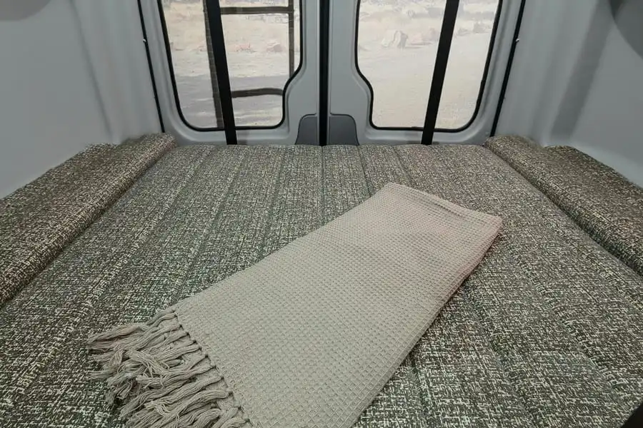 The electric-lift main bed is located in the rear