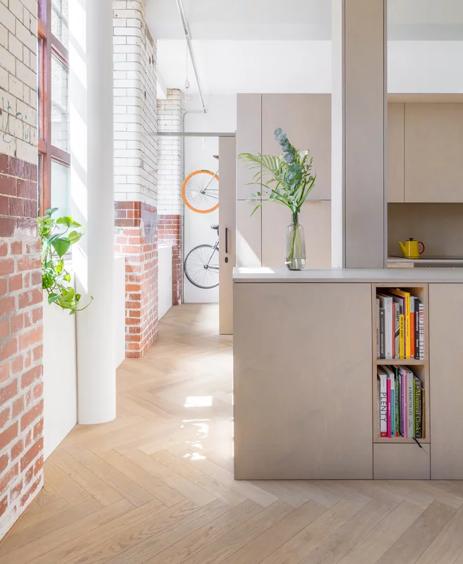 As an additional aesthetic consideration the architects chose to enhance the home's biscuit factory features by exposing the original brick work