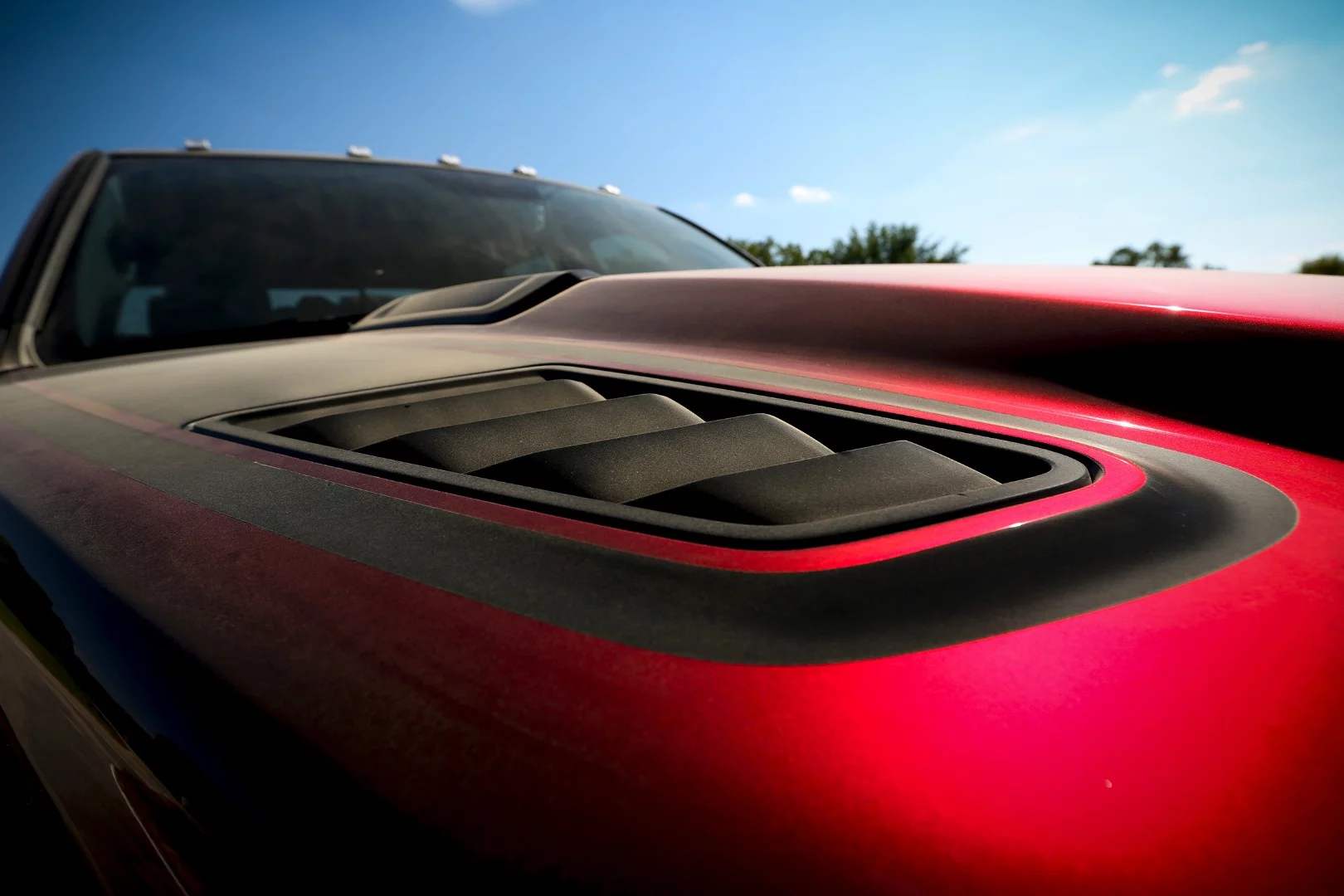 The Rebel TRX hood lets the supercharged HEMI below breathe