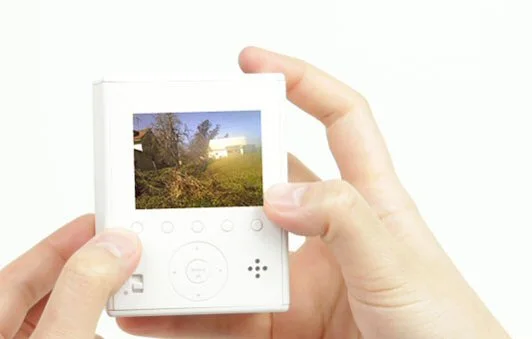 To the rear is a small LCD screen for preview/playback, a menu wheel and physical programmable mode selection buttons