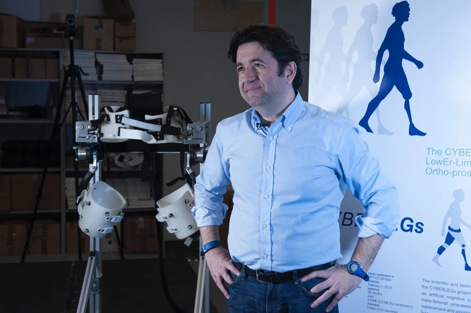 Silvestro Micera of EPFL and Scuola Sant'Anna standing next to a prototype of the exoskeleton