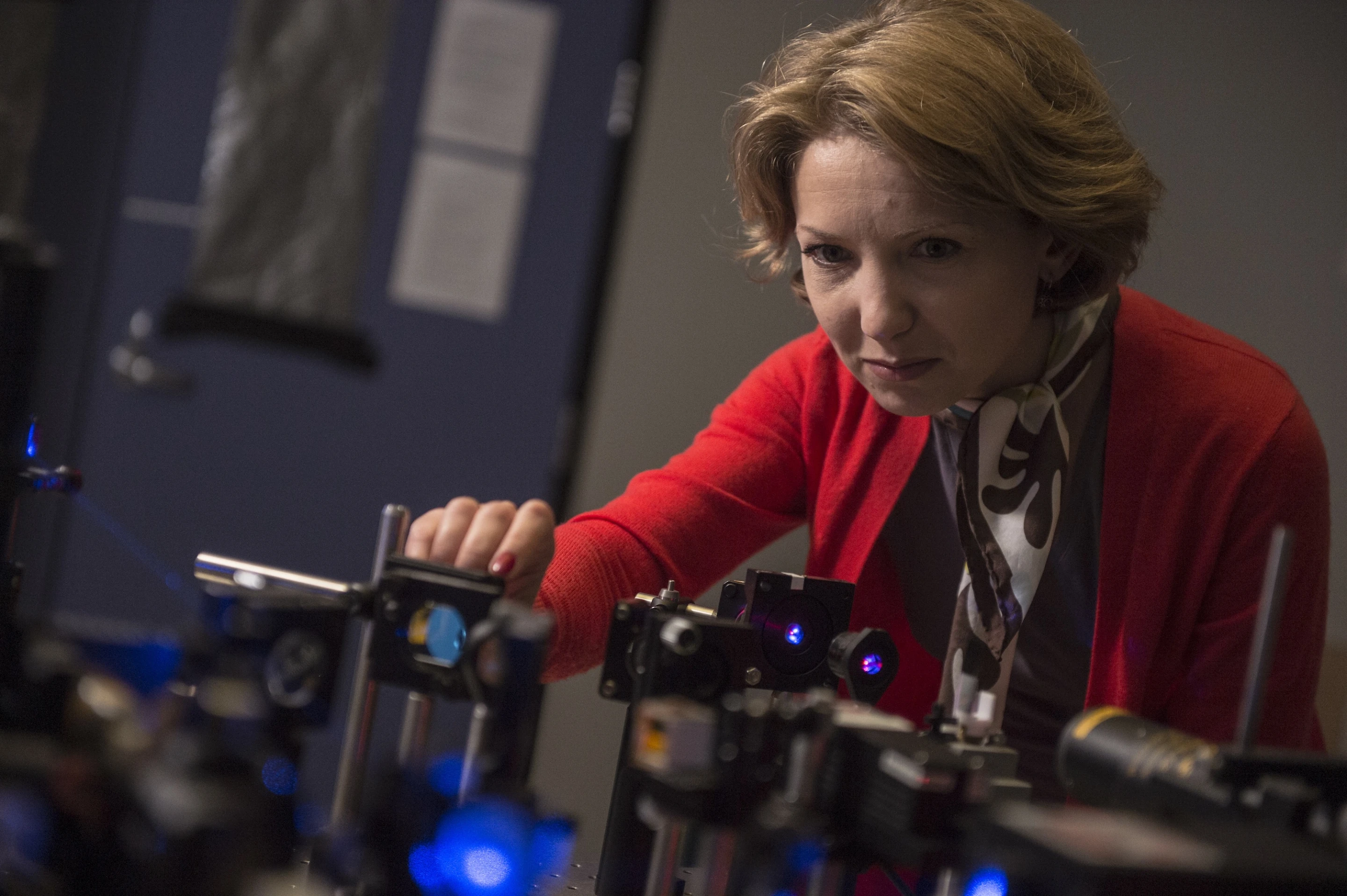 Rice University research scientist Ekaterina Lukianova-Hleb adjusts equipment used in experimentation on plasmonic nanobubbles. (Credit: Jeff Fitlow/Rice University)