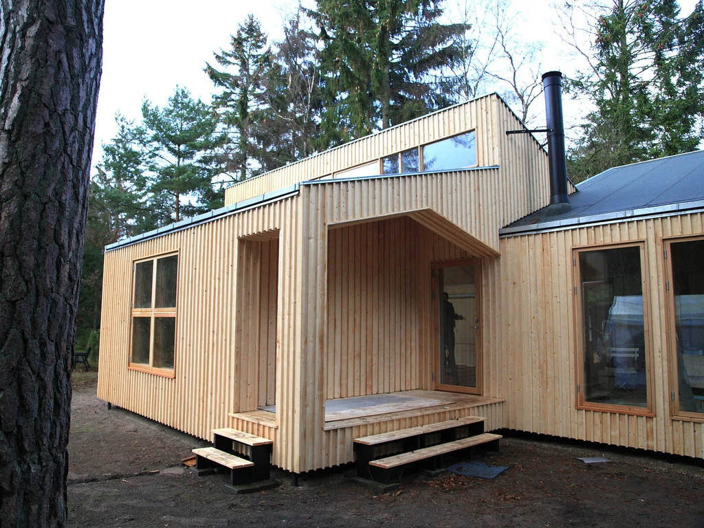 This 115 m² (1,250 ft²) home was built from 800 sheets of sustainable plywood