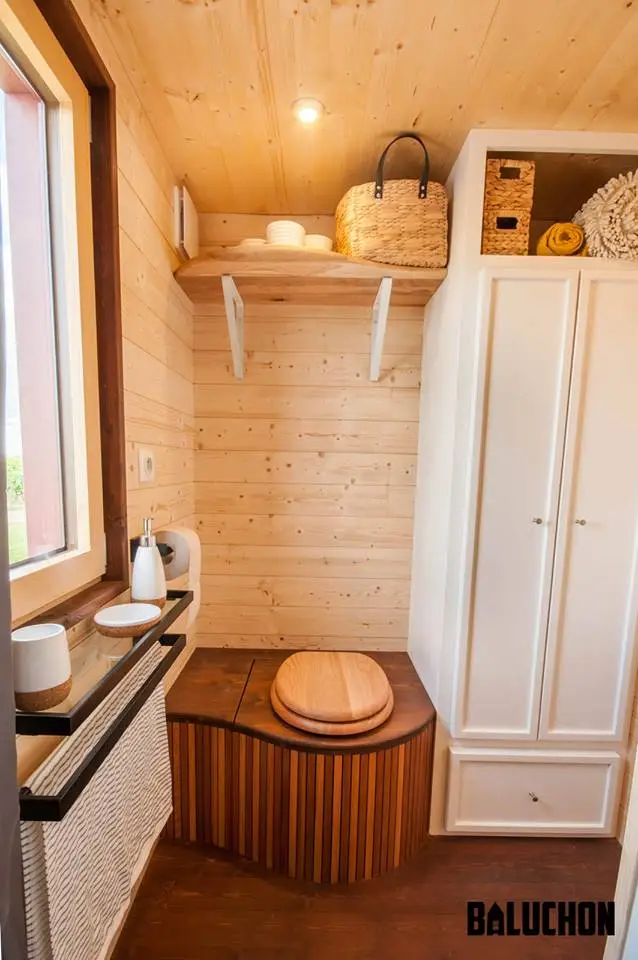 The Pampille's bathroom includes a shower, toilet and storage space