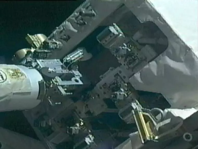Dextre stows the Multifunction Tool with the Tertiary Cap Adapter attached (Image: NASA)