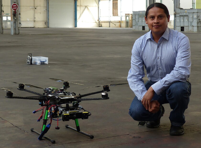 Prof. Martinez Carranza with one of the drones used in his research