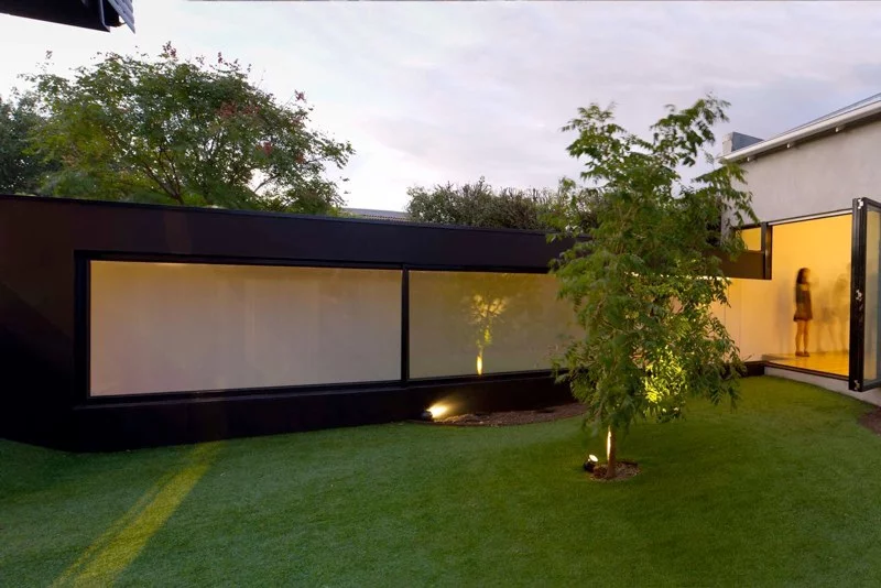 The passage provides direct access to the back entrance and new living zones