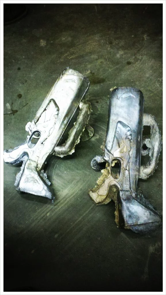 The sand-cast aluminum main body housing, based on a Nerf gun