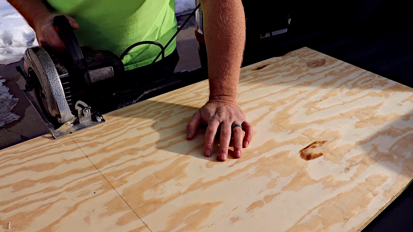 Here the author is using the F-150 Powerboost's external outlets and power generator to run a circular saw for a build