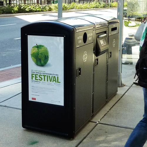 Bigbelly solar-powered recycling/garbage bins sitting are enclosed to prevent leaks and smells