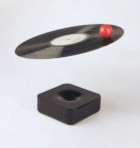 Audio output is produced by the little red ball spinning around on top of the LP