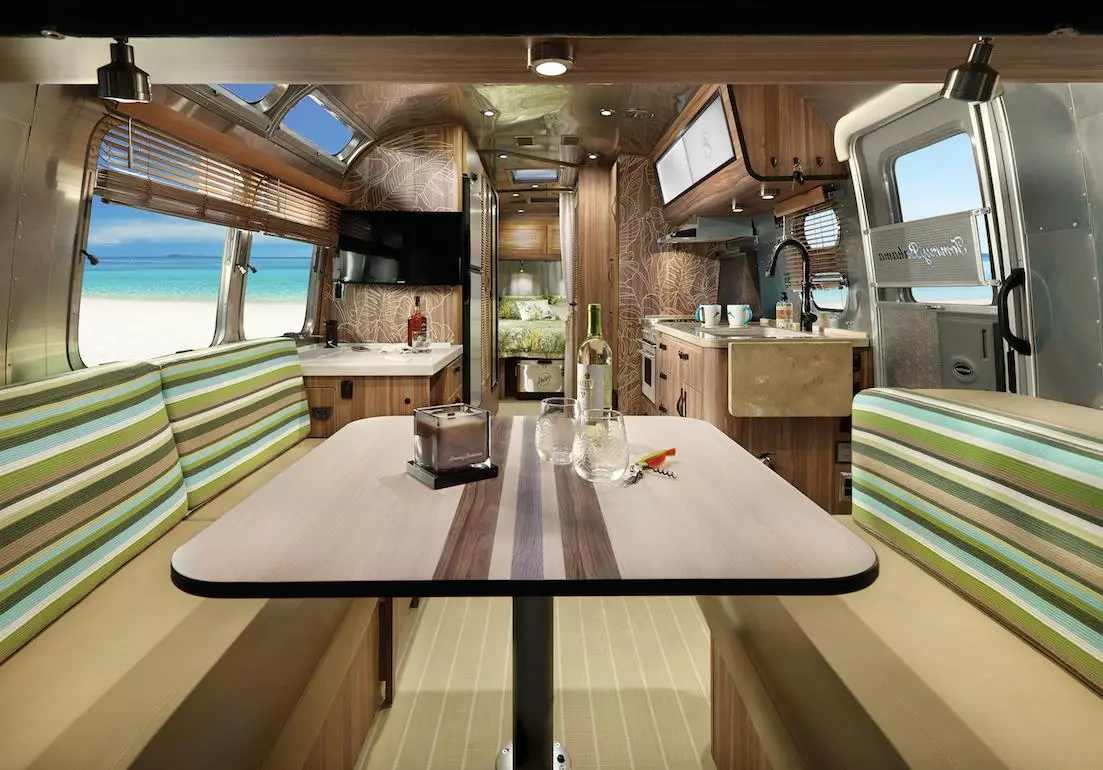 The surfboard-inspired dining table is another beach tie-in