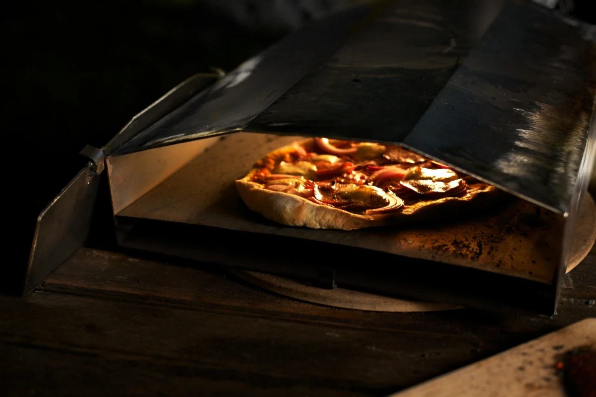 The Uuni is a lightweight, wood-burning pizza oven that's small enough to fit in a kitchen and cooks a pizza in under three minutes
