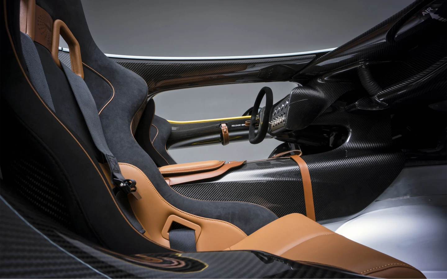 Racing seats in Bridge of Weir leathers come with full safety harnesses while the carbon bridge is open to reduce claustrophobia
