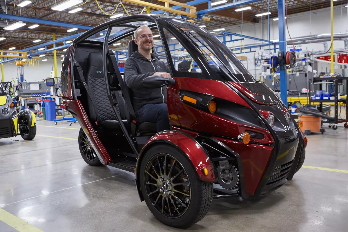 Arcimoto's founder and president Mark Frohnmayer prepares the first FUVs for delivery to customers