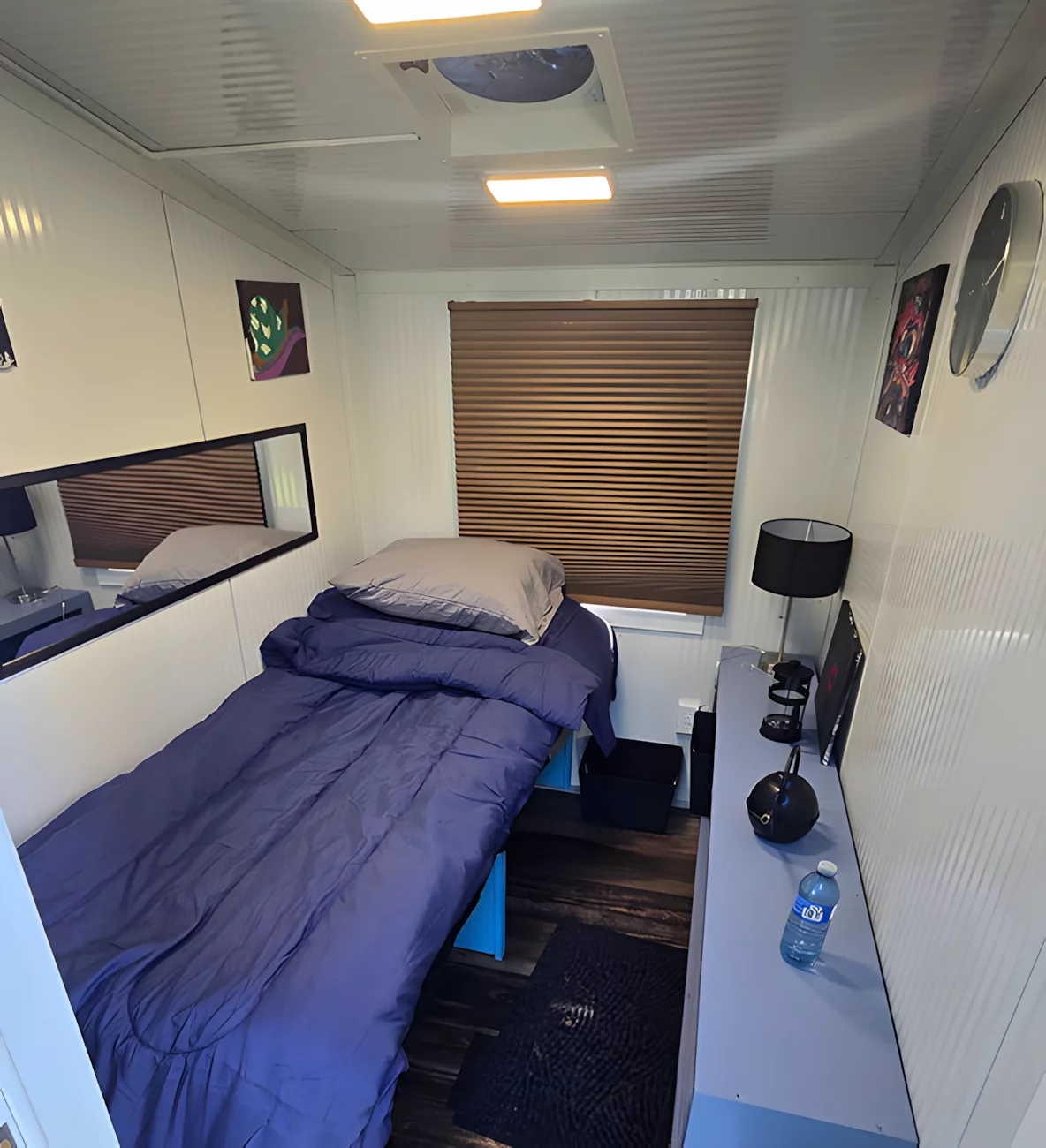 A bed/daybed is installed, and has some storage space underneath
