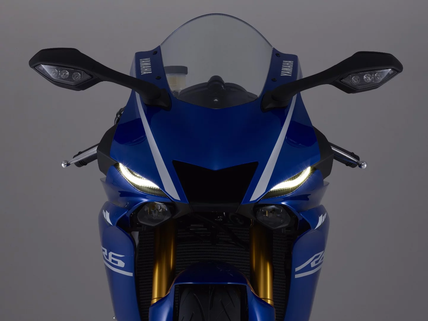 The front cowl of the 2017 Yamaha YZF-R6 is dominated by a huge MotoGP-inspired air intake, with LED daytime running lights at its sides