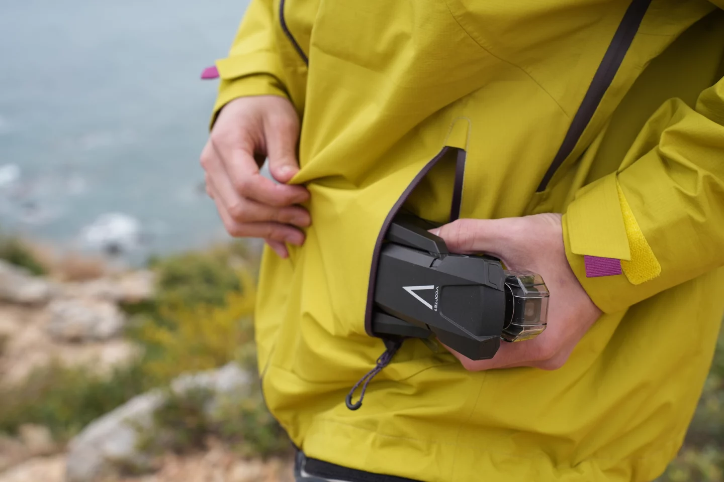 The drone's two propeller arms can be folded in when it's not in use