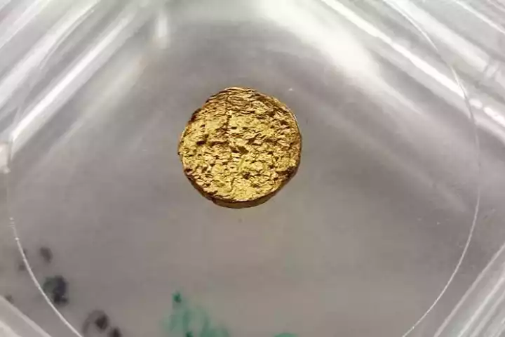 A piece of the new lightweight gold made with plastic