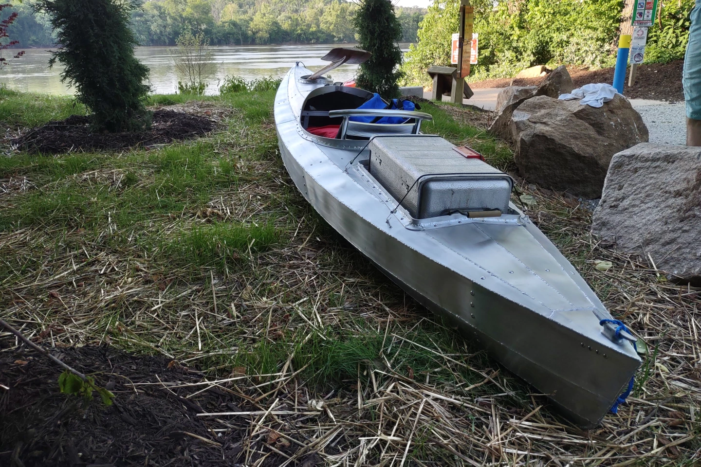 The scavenged secondhand cooler's aluminum exterior nicely matches the kayak