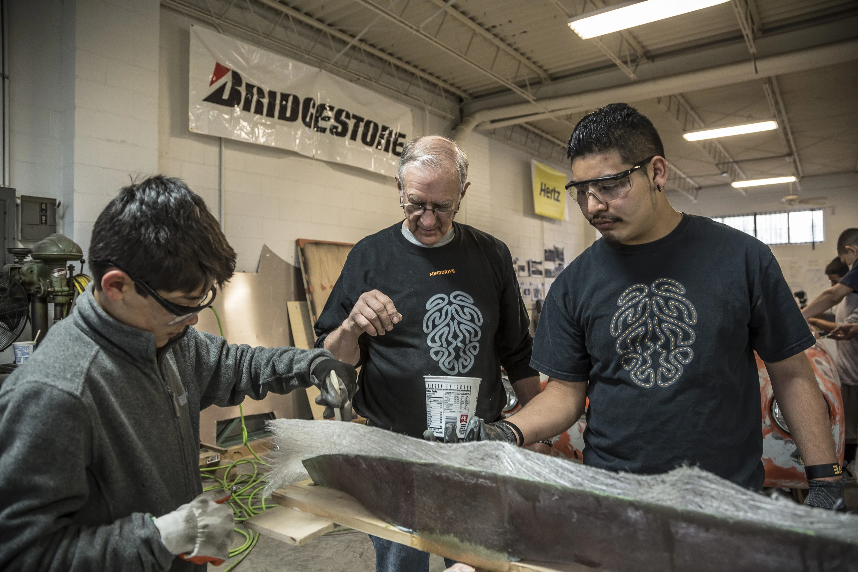 Mentor and students molding and shaping