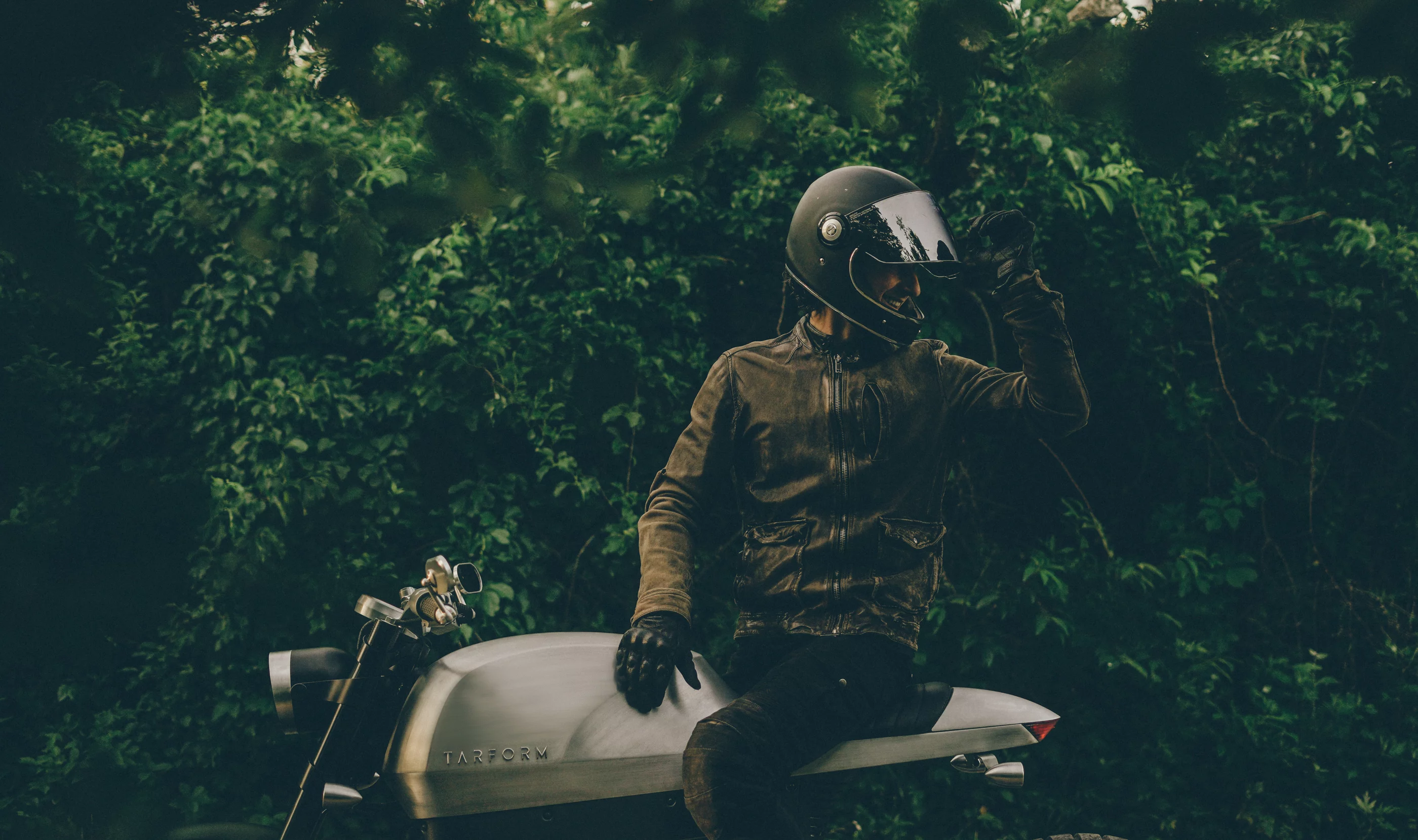 Captain Retro sits on the bike and looks backwards