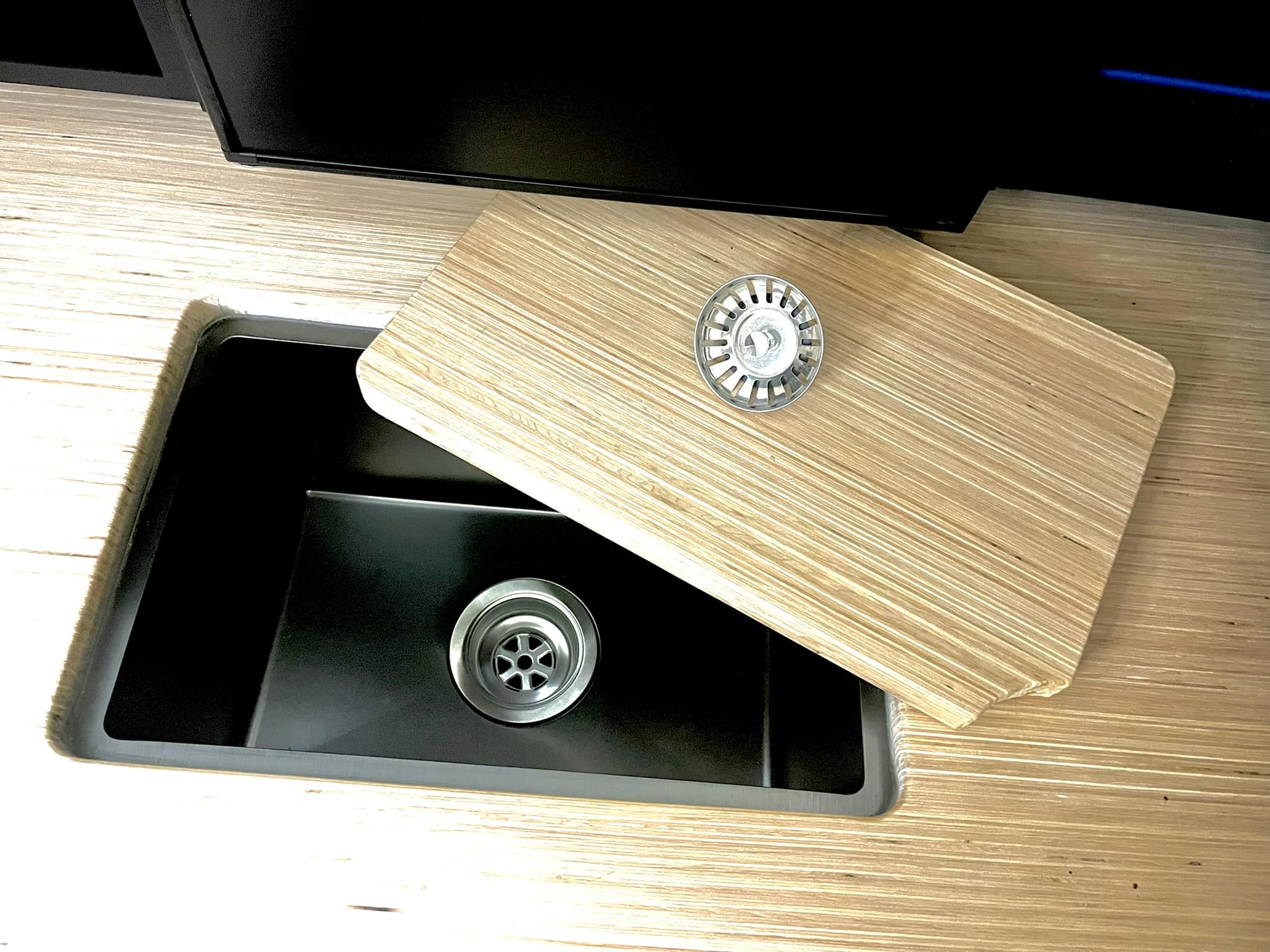 The sink lid drops in to create more uninterrupted work space