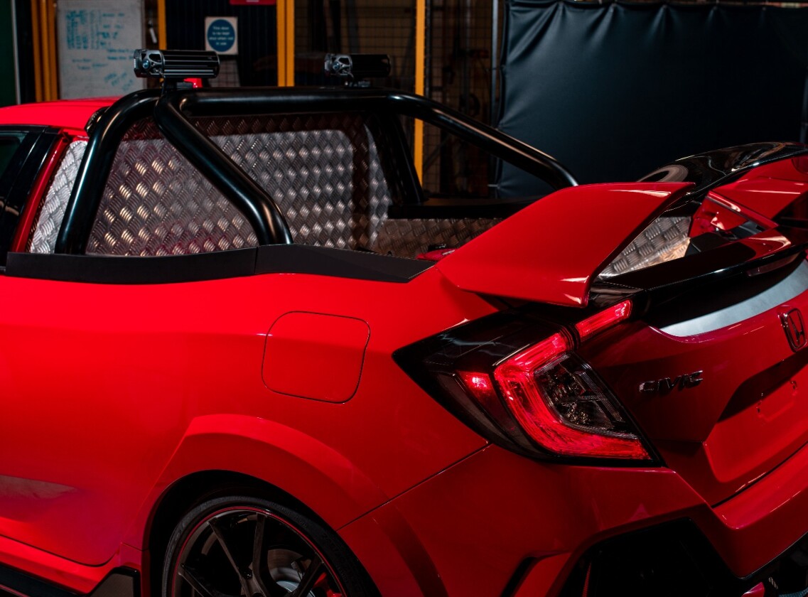 Honda's team pulled the rear seats out and stuck in a pickup bed and roll cage