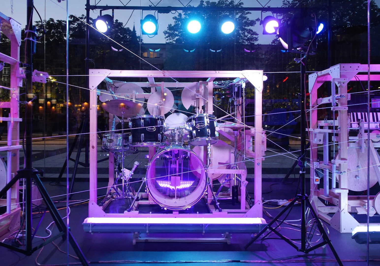 Taking stage center in the installation is a full acoustic drum kit, with toms, a snare, cymbals and a kick drum