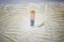 The MEDS device, with ingestible capsules for scale