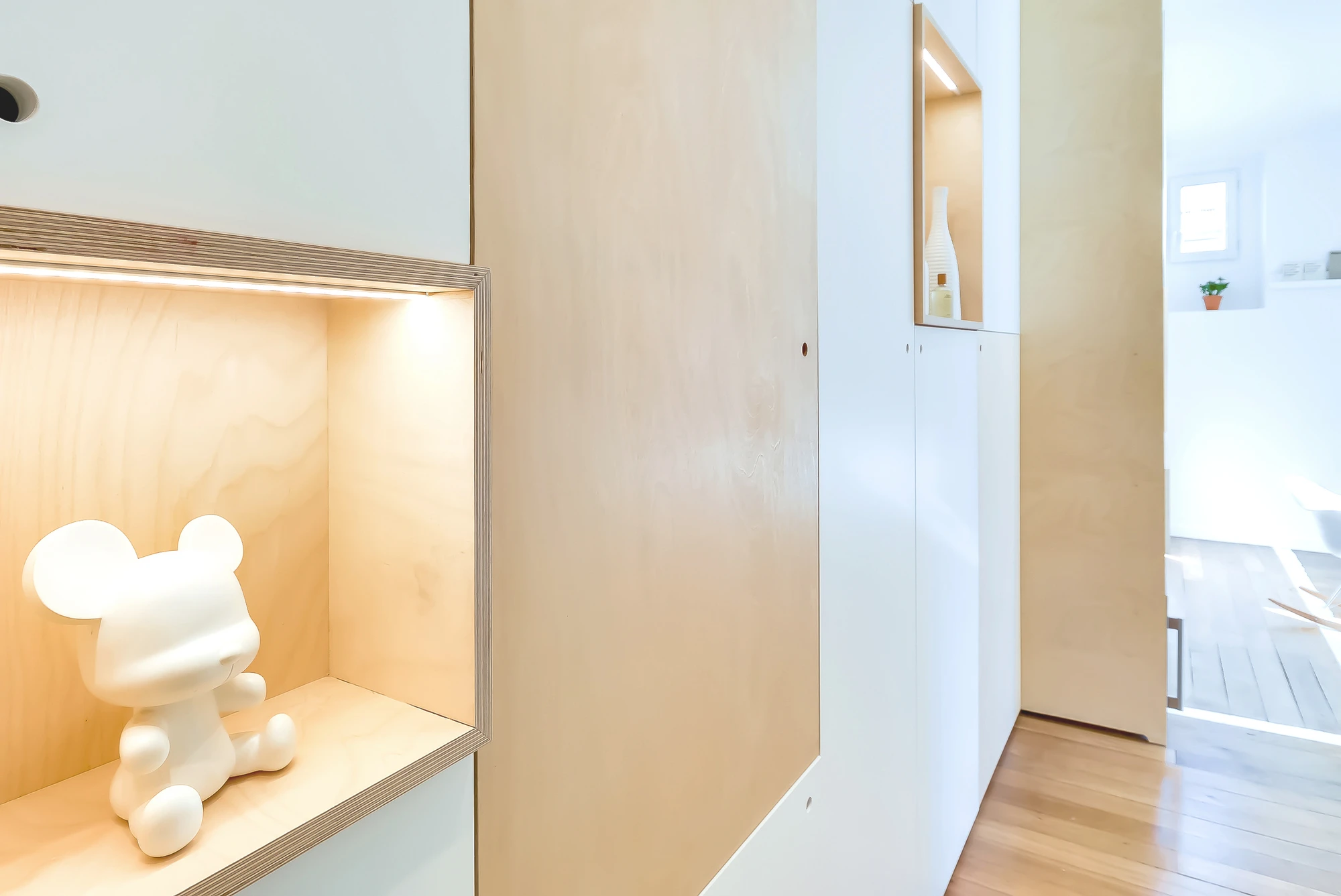 The bedroom is sealed off from the rest of the snug apartment with a sliding door, but the owner's cat has its own entrance to a crawlspace that lies beneath the bedroom (Photo: Meero)