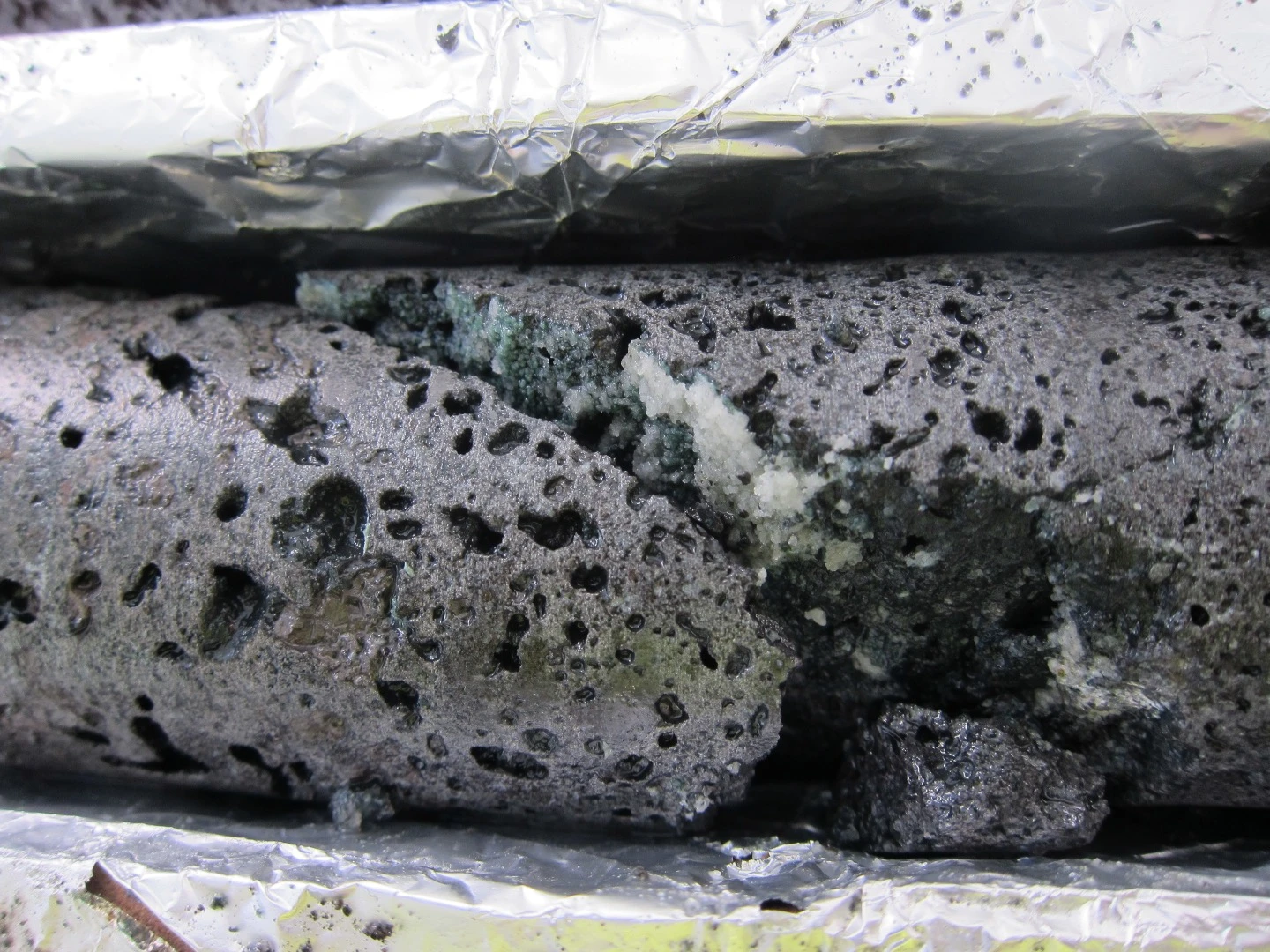 Basalt core containing carbonates - the white mineral is the CO2