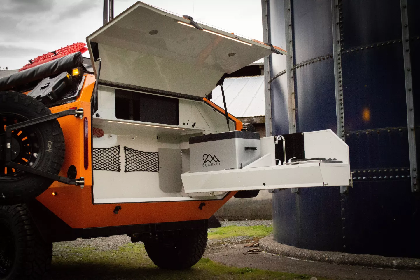 The ELE has the same style of swing-out tailgate kitchen as the original Mammoth trailer