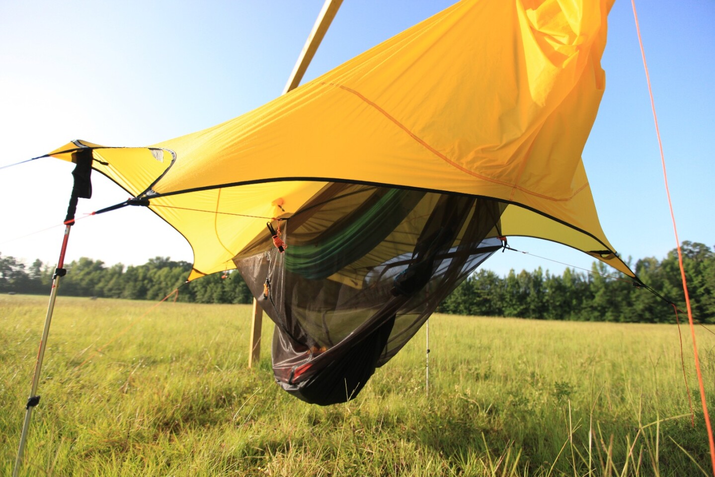 A fully assembled Nube Stratos, fastened to walking poles