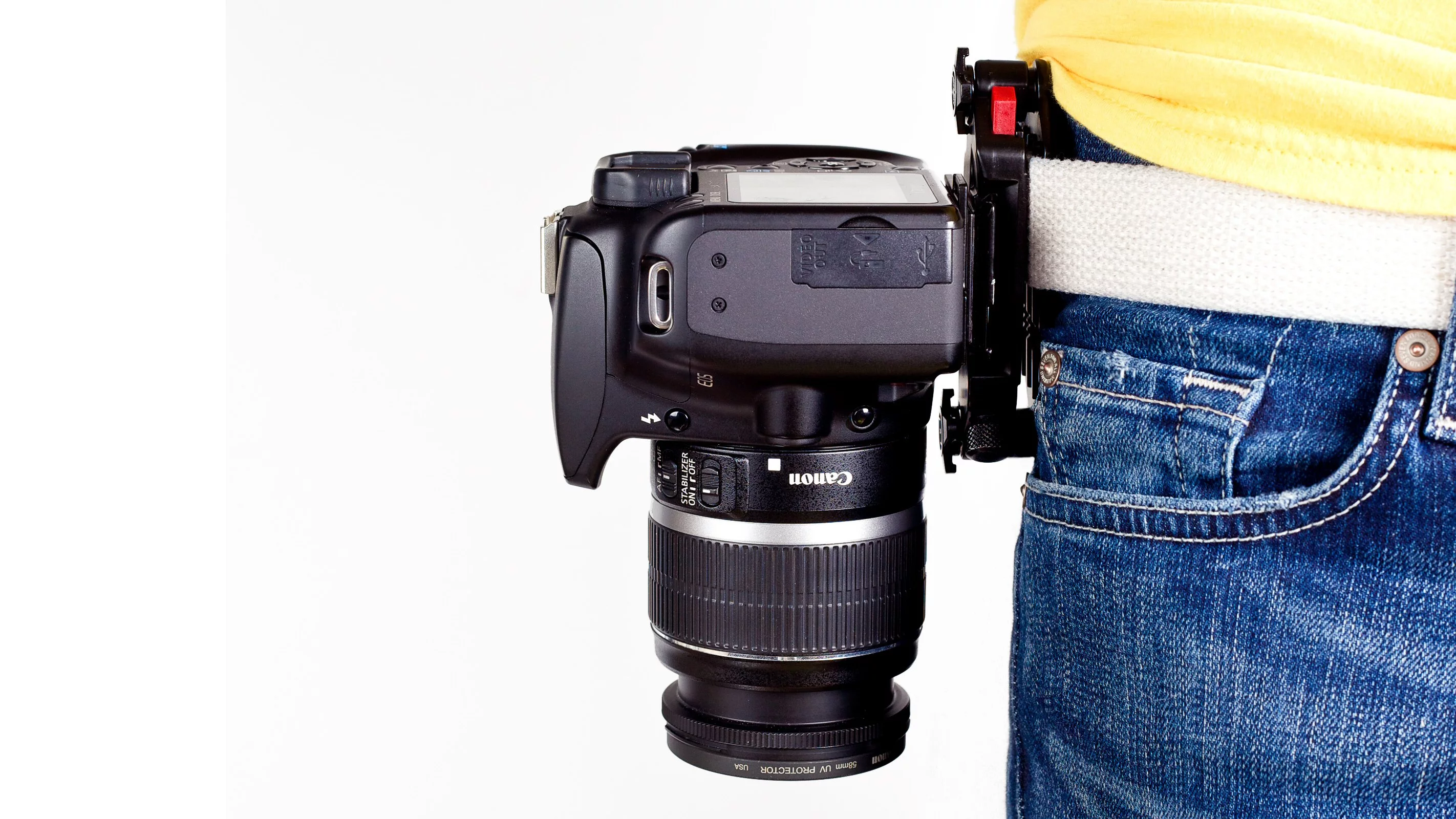 After attaching a plate to the bottom of a camera and then clamping the Capture Camera Clip's main chassis to a belt or bag strap, users can grab and shoot the DSLR as quick as a gunslinger from a cheesy Western