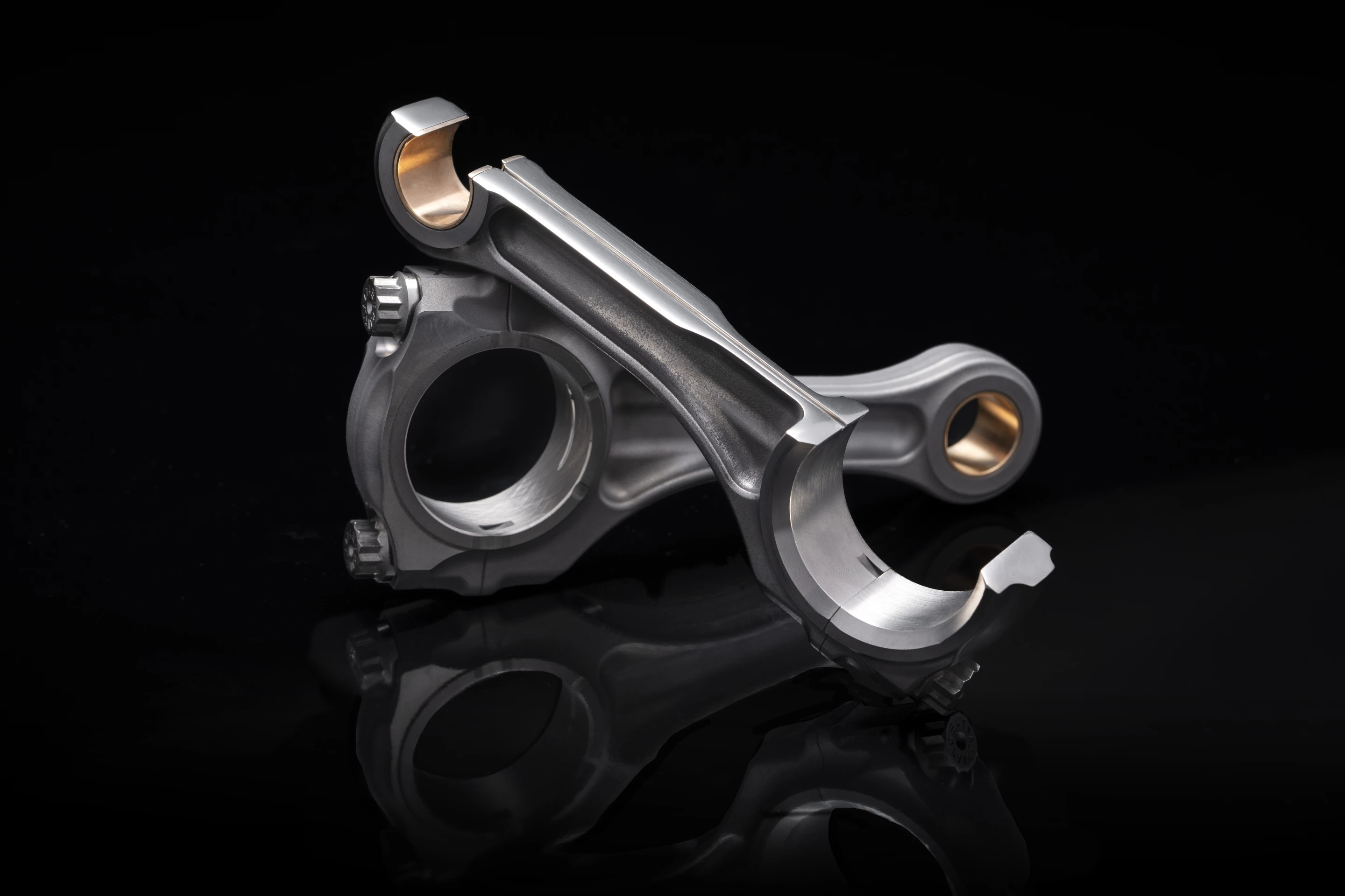 That tiny 1.6-mm channel running down each connecting rod delivers oil from one end to the other