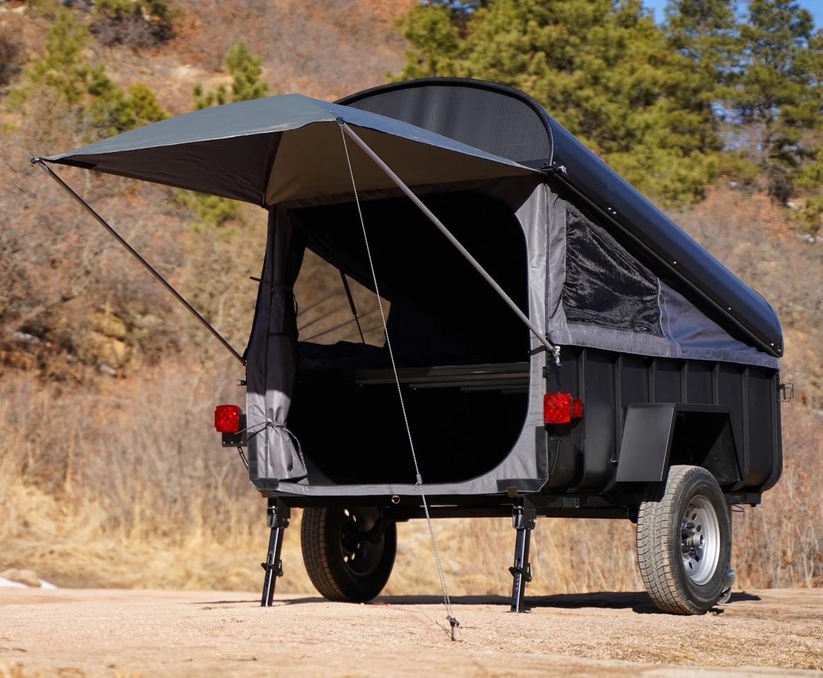 The Crashpad kit includes three fabric walls, an awning and a sleeper platform to turn a basic hard-cover trailer into a cozy camper