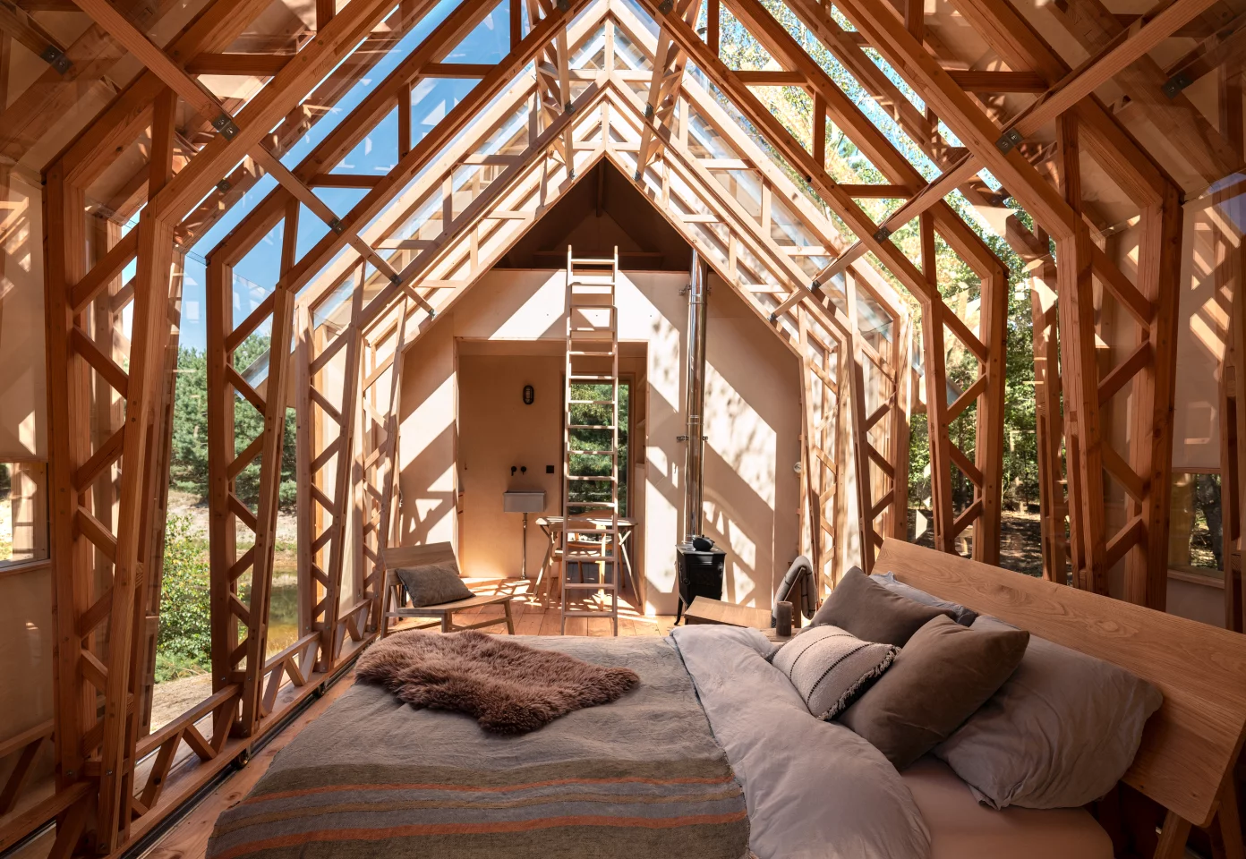 Anna Stay, by Caspar Schols, includes a bed on the main floor and another on the upper mezzanine area, which is reached by removable ladder