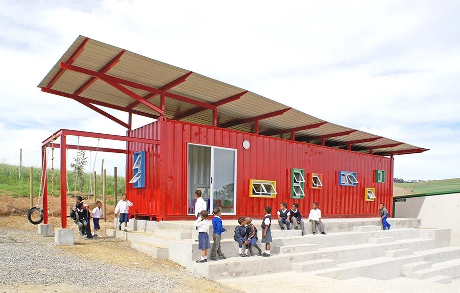 The most radical addition to the container is a horizontal solar shade - an expansive second roof above the container preventing solar radiation directly arriving at the classroom's outer surfaces thanks to the buffer of air between