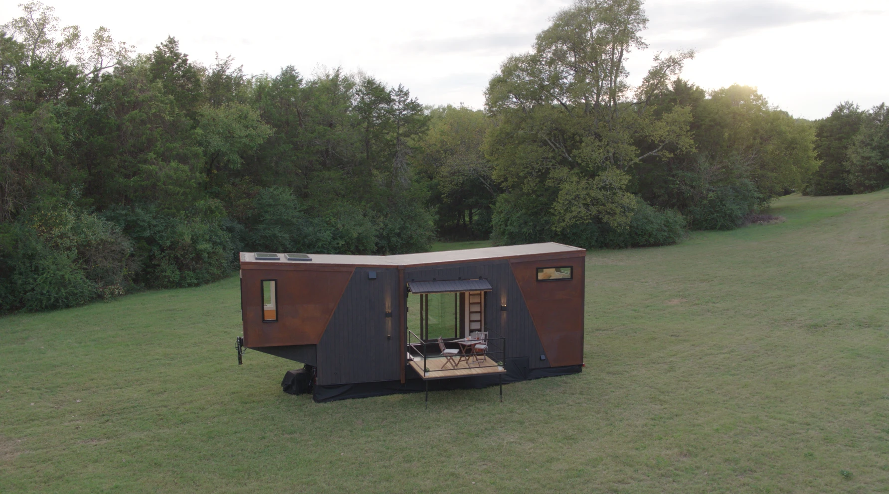 The Home That Runs on Dunkin' is clad in black stained cedar wood and weathered steel panels
