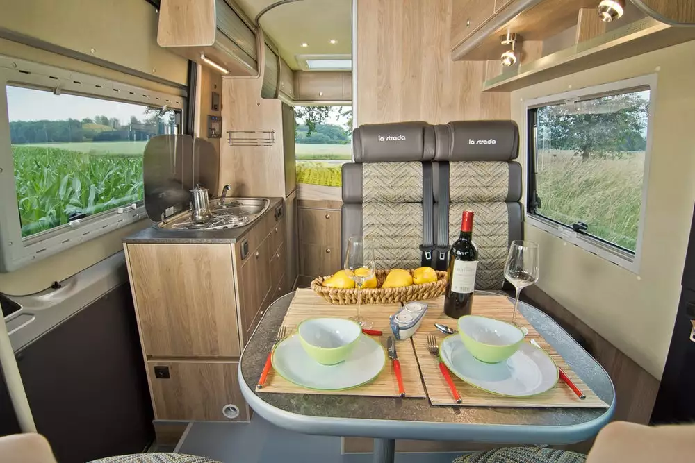 The Regent S includes a front dinette and a central kitchen block with triple-burner stove, compressor fridge and sink
