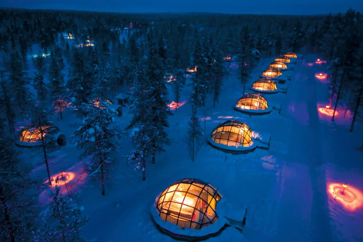 Located in the Arctic Circle, Igloo Village features glass-roofed igloos from which guests can watch the northern lights (image from Hotel Kakslauttanen)